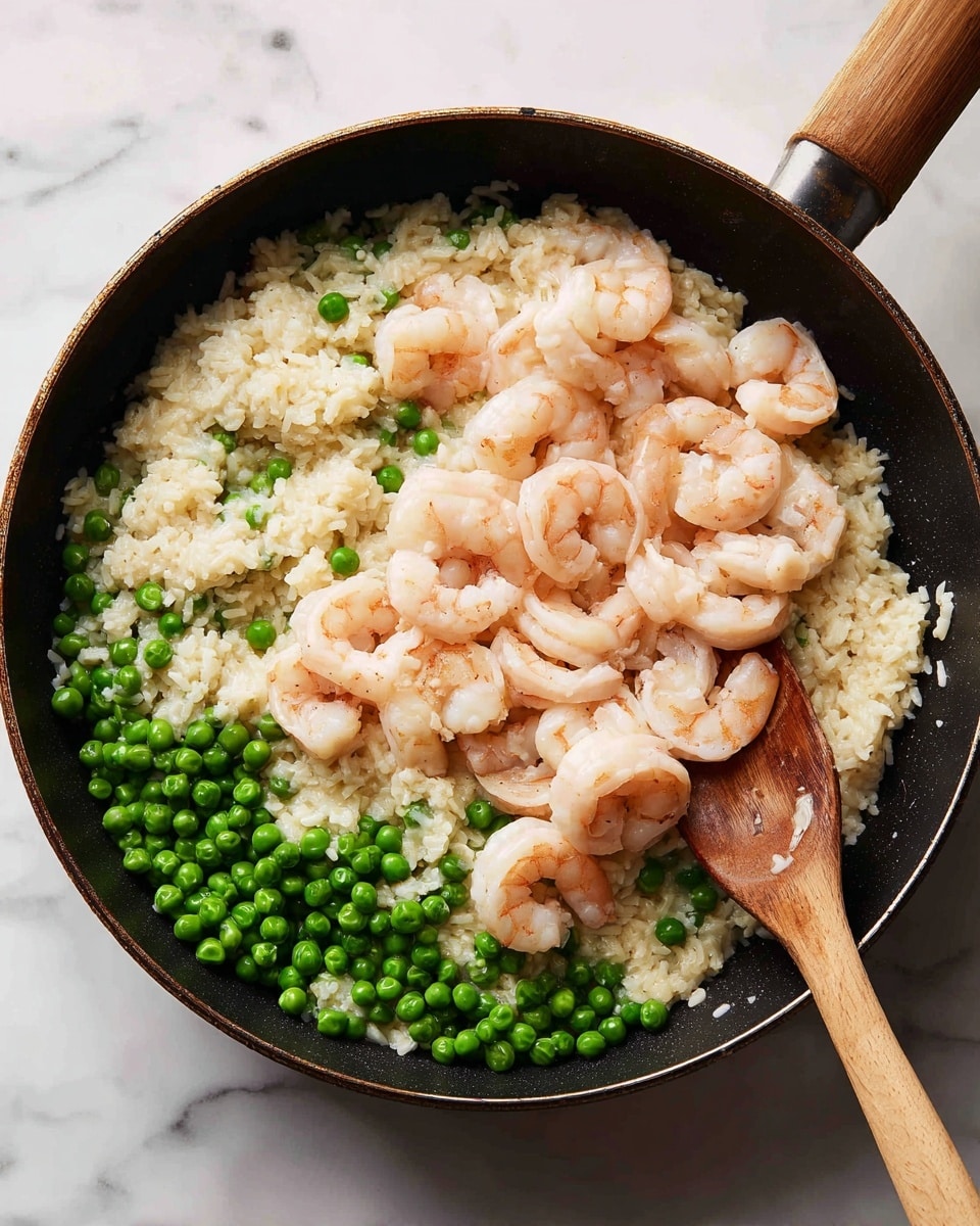 A close-up view of a black pan showing four stages of cooking shrimp and rice with green peas. The first stage shows creamy rice with bright green peas piled in the center. The second stage shows rice mixed with evenly spread peas, with a wooden spoon stirring from the right side. The third stage shows raw pale pink shrimp layered on top of the rice and peas, covering almost the whole surface. The fourth stage shows the shrimp cooked to a soft pink color, scattered on top of rice and peas, with the wooden spoon stirring from the right side. The background surface is white marble. photo taken with an iphone --ar 4:5 --v 7
