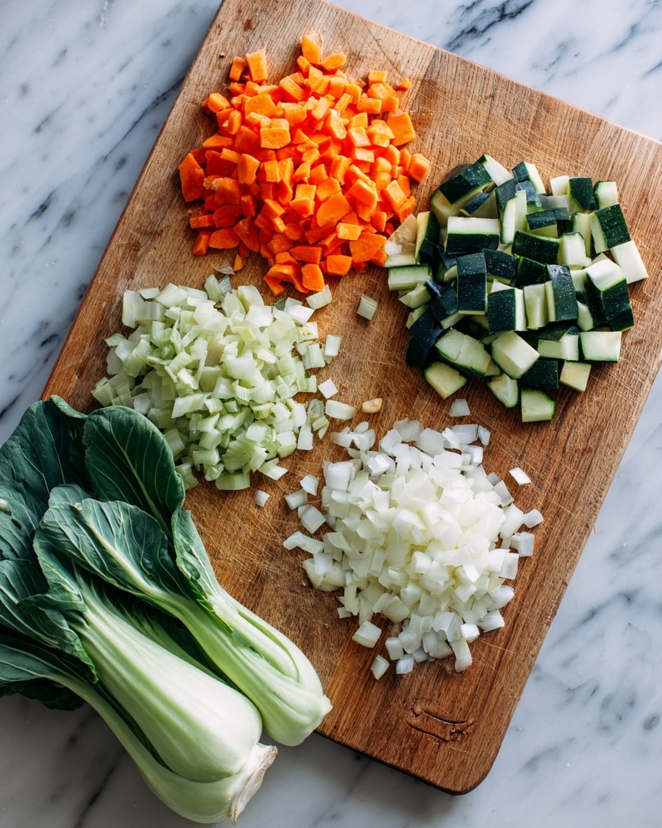 A wooden cutting board placed on a white marbled surface holds four neat piles of chopped vegetables arranged in a rough square. The top left pile is bright orange diced carrots, above a pile of light green diced zucchini with dark green skin. Below the zucchini lies a pile of white chopped onions with a slightly translucent texture, and on the bottom left corner near the edge are small pieces of chopped garlic. To the left of the board rests two fresh bok choy with smooth, pale green stalks and dark green leaves. Photo taken with an iphone --ar 4:5 --v 7