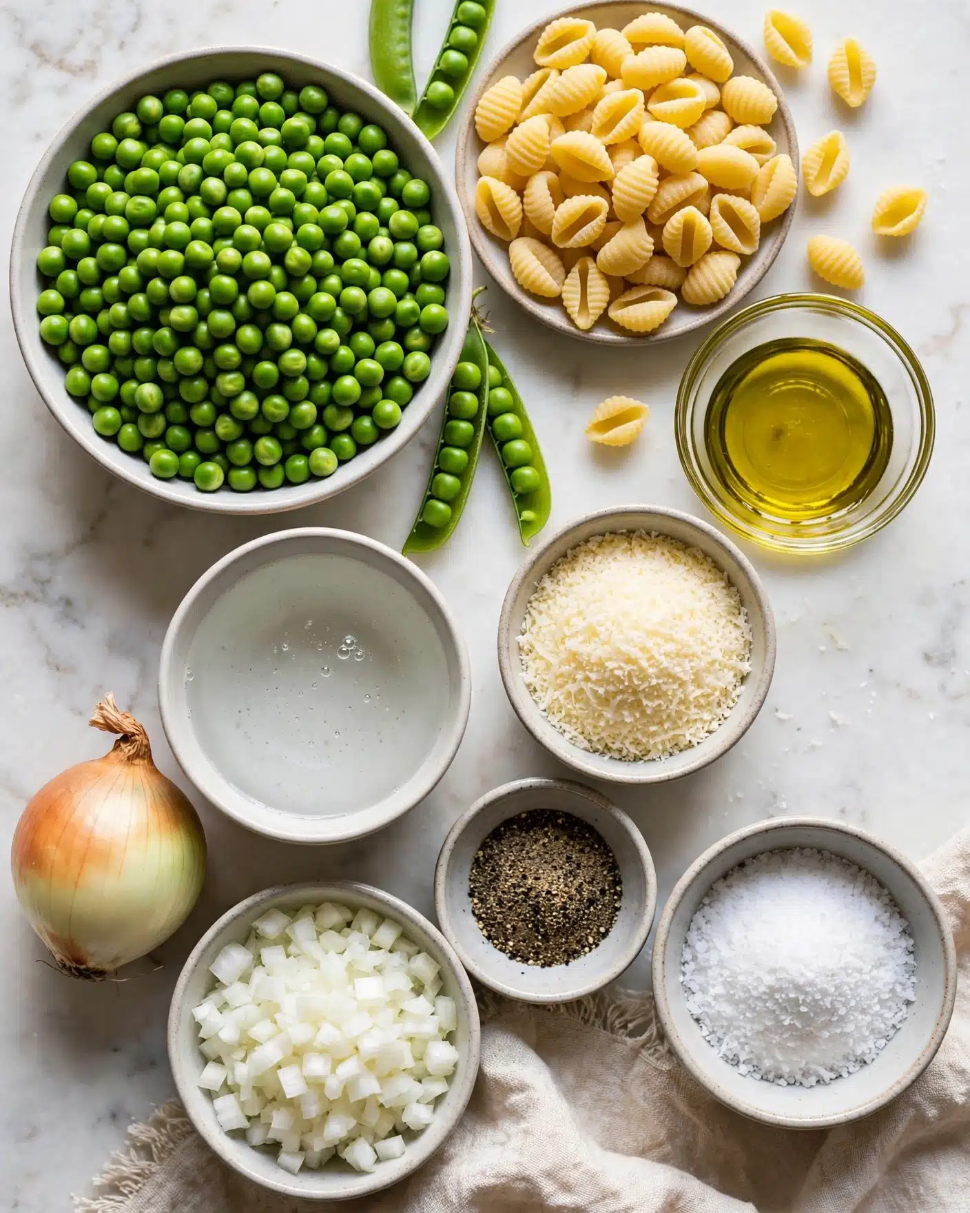 The image shows six steps of making a green pea pasta sauce in a white pan on a white marbled surface. Step one has bright green peas mixed with cooked chopped white onions spread evenly inside the pan. Step two displays cooked peas on a white plate above half of the peas placed inside a clear blender container. Step three focuses on a white pot with boiling water on a stove. Step four shows smooth bright green pea sauce inside the clear blender container with a few small bubbles visible. Step five has the white pan filled with the green pea sauce, fresh peas, pale cooked small pasta shells, and grated white cheese scattered on top from a woman's hand on the left. Step six presents the white pan full of pasta mixed evenly with the green pea sauce, making the pasta coated in a light green color with peas mixed throughout. photo taken with an iphone --ar 4:5 --v 7