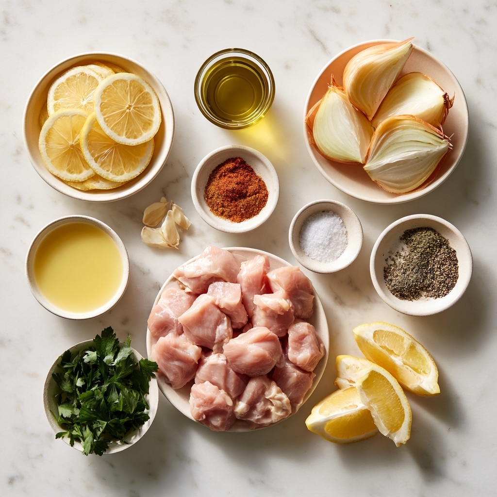 A clear glass bowl sits on a white marbled surface, filled with raw chicken pieces mixed with a light yellow marinade speckled with green herbs and small white bits. The chicken pieces are soft pink with a slightly glossy texture from the marinade, loosely layered inside the bowl, showing a mix of small and medium-sized chunks. photo taken with an iphone --ar 4:5 --v 7