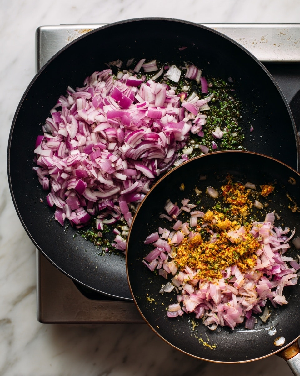 The image shows two black pans on a stove with chopped onions cooking inside them. The pan on the left has a large pile of fresh chopped red onions, which have a purplish-pink color with a crisp texture, sitting over some green herbs and oil. The pan on the right shows the onions softened to a light pink color, mixed with small pieces of garlic and yellow-orange spices on top, with bits of green herbs visible around. The stove has a metallic edge, and the surface under the pans is a white marbled texture. photo taken with an iphone --ar 4:5 --v 7