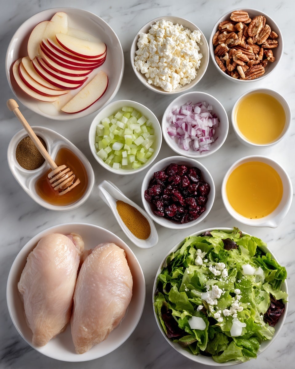 The image shows a white bowl filled with fresh mixed green leafy salad at the bottom right corner. To its left, there is a white bowl with two large pale raw chicken pieces. Above the chicken, there are small white bowls each containing different ingredients: crumbled white cheese, light green diced celery, thinly sliced purple onion, dark dried cranberries, whole glazed nuts, and a dark syrup with a wooden honey dipper resting in it. At the top left, there is a white plate with thin red and cream apple slices arranged neatly. Around these larger bowls, there are several small white bowls holding various powders, spices, and liquids, including a yellow mustard sauce, orange juice, and light-colored seasonings. The whole setup is placed on a white marbled surface, creating a bright and clean look. photo taken with an iphone --ar 4:5 --v 7