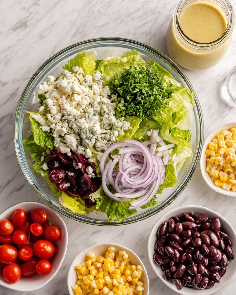 A glass bowl on a white marbled surface holds a fresh salad with four visible layers: the base is green romaine lettuce leaves, topped with a pile of white crumbly cheese on the left, a bunch of chopped green herbs on the right, and thin pale purple sliced onions on top. Around the bowl, there are small white bowls filled with halved bright red cherry tomatoes, yellow corn kernels, and shiny black beans. Behind the salad bowl, there is a small glass jar with a creamy mustard-yellow dressing. Photo taken with an iphone --ar 4:5 --v 7