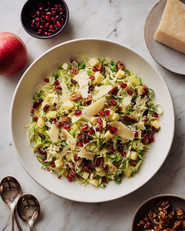 Shaved Brussels Sprout Salad with Pomegranate and Candied Pecans Recipe