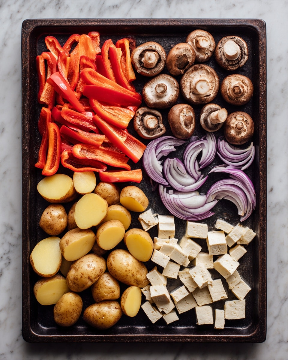 A dark baking tray filled with six organized sections of raw ingredients. Starting from the top left, there are bright red sliced bell peppers with smooth shiny texture. Next to them are halved brown mushrooms showing their white inside. To the right are curved slices of purple onion with white layers inside. Below the peppers are quartered small light brown potatoes with a matte skin. Next to these are smaller quartered yellow potatoes with a rough texture. Lastly, on the bottom right, there are small off-white cubes of tofu with a slightly rough surface. The tray is resting on a white marbled surface. Photo taken with an iphone --ar 4:5 --v 7